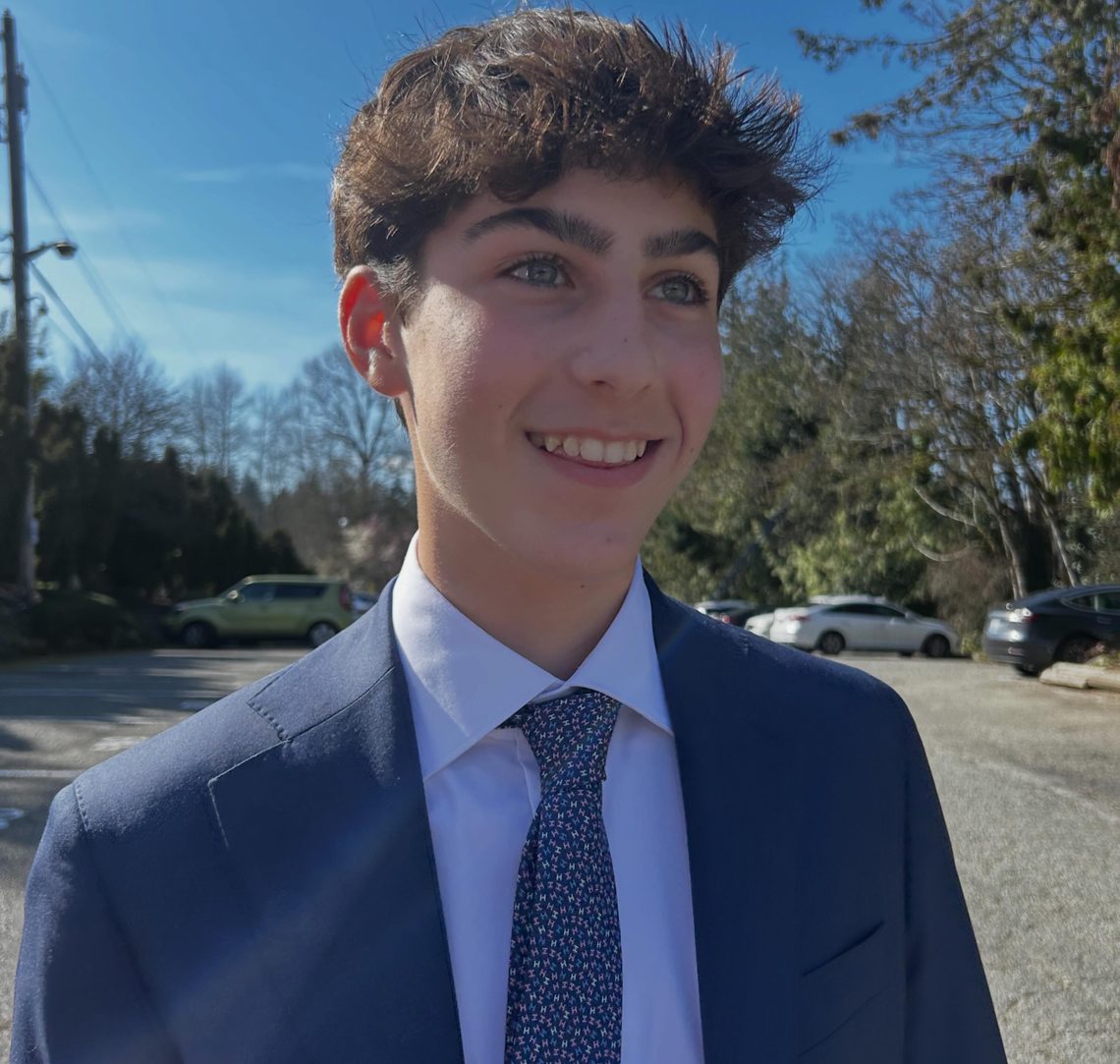 Eliot Abramson in a suit and tie, outdoors.